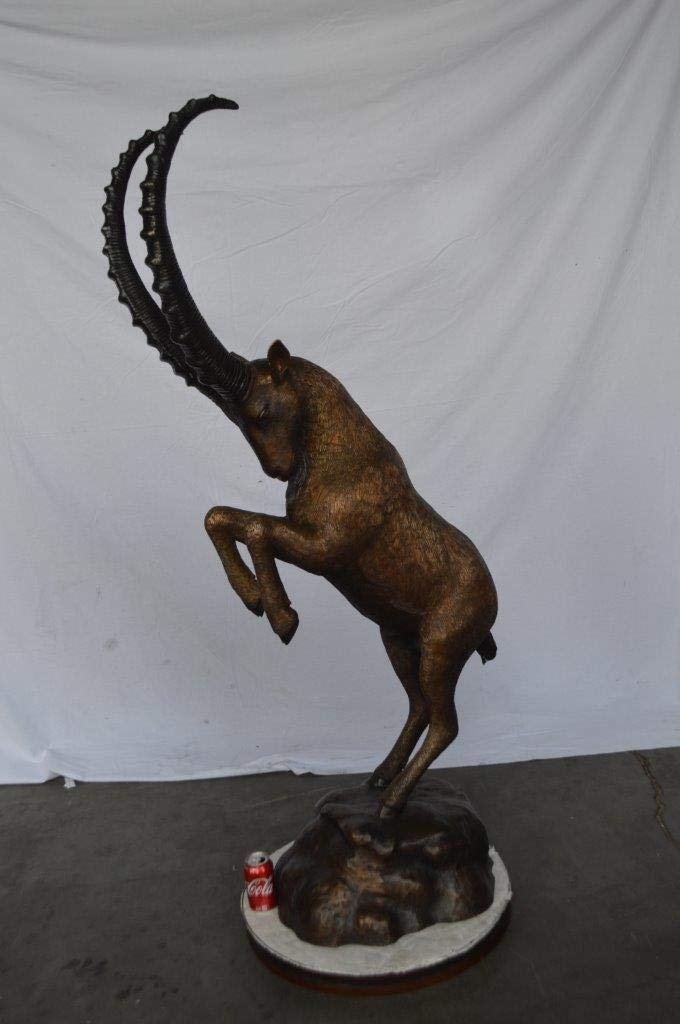 Mountain goat on hind legs bronze statue -  Size: 36"L x 16"W x 66"H.