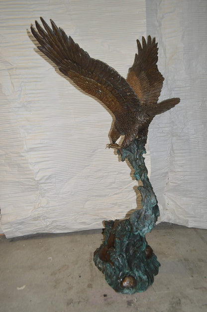 Flying Eagle on Wave Bronze Statue -  Size: 25"L x 35"W x 57"H.
