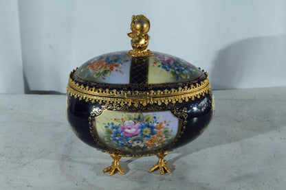 NIFAO Porcelain floral egg shaped lidded box with cherub and chicken feet 11"x8"x12"H