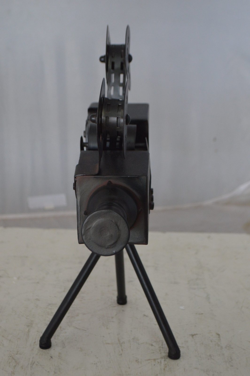 Movie Reel Abstract Metal Statue on tripod -  Size: 12"L x 6"W x 15"H.