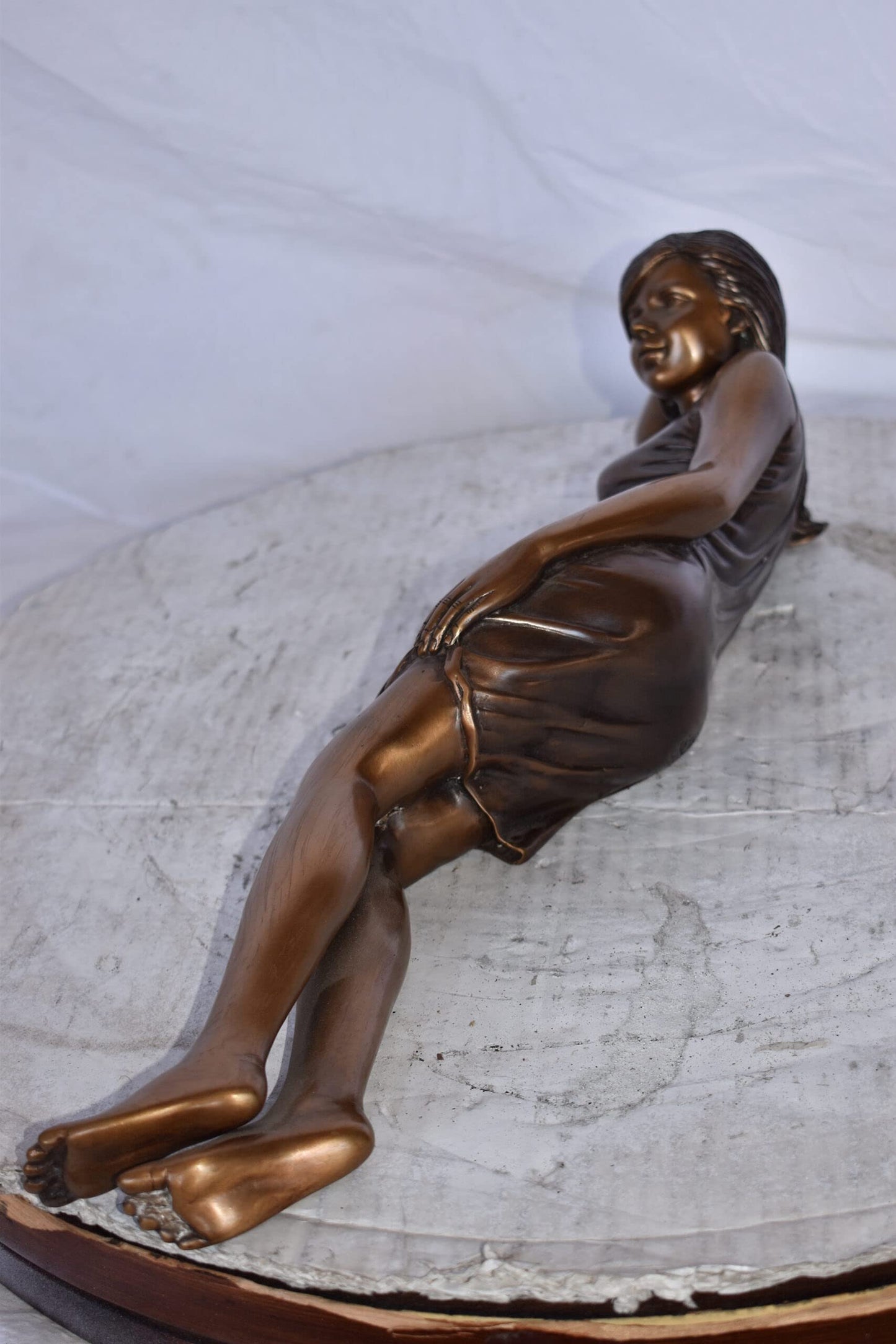 Gorgeous Young Lady Laying on The Ground Bronze Statue - Size: 5"L x 21"W x 5"H.