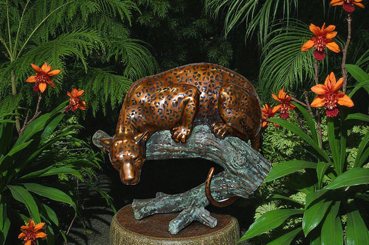 Leopard on a Tree Trunk Bronze Statue -  Size: 38"L x 34"W x 36"H.