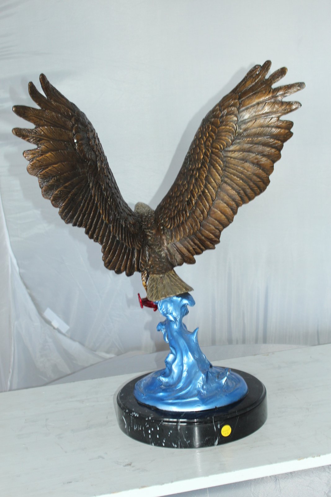 Eagle Catching his Prey Bronze Statue -  Size: 17"L x 20"W x 25"H.
