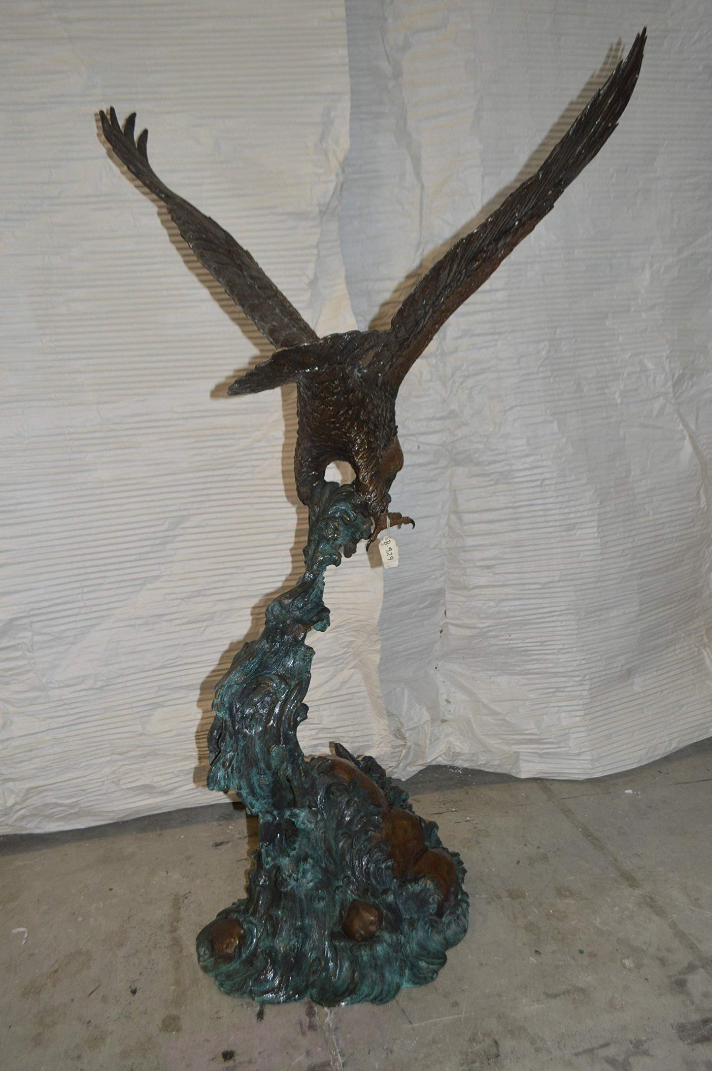 Flying Eagle on Wave Bronze Statue -  Size: 25"L x 35"W x 57"H.