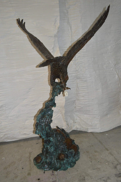 Flying Eagle on Wave Bronze Statue -  Size: 25"L x 35"W x 57"H.