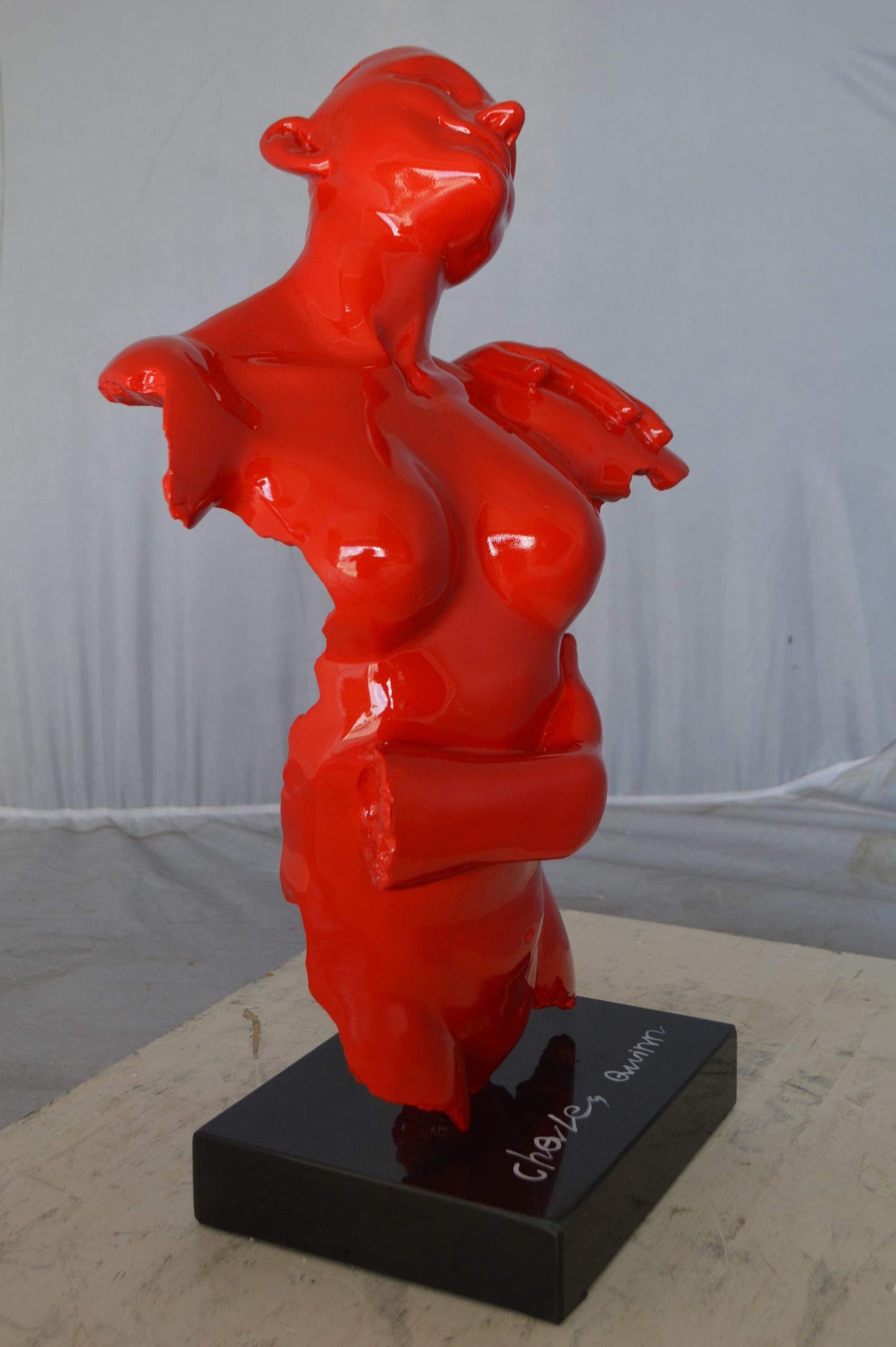 Modern resin statue of a woman hugged by a men -  Size: 13"L x 9"W x 24"H.