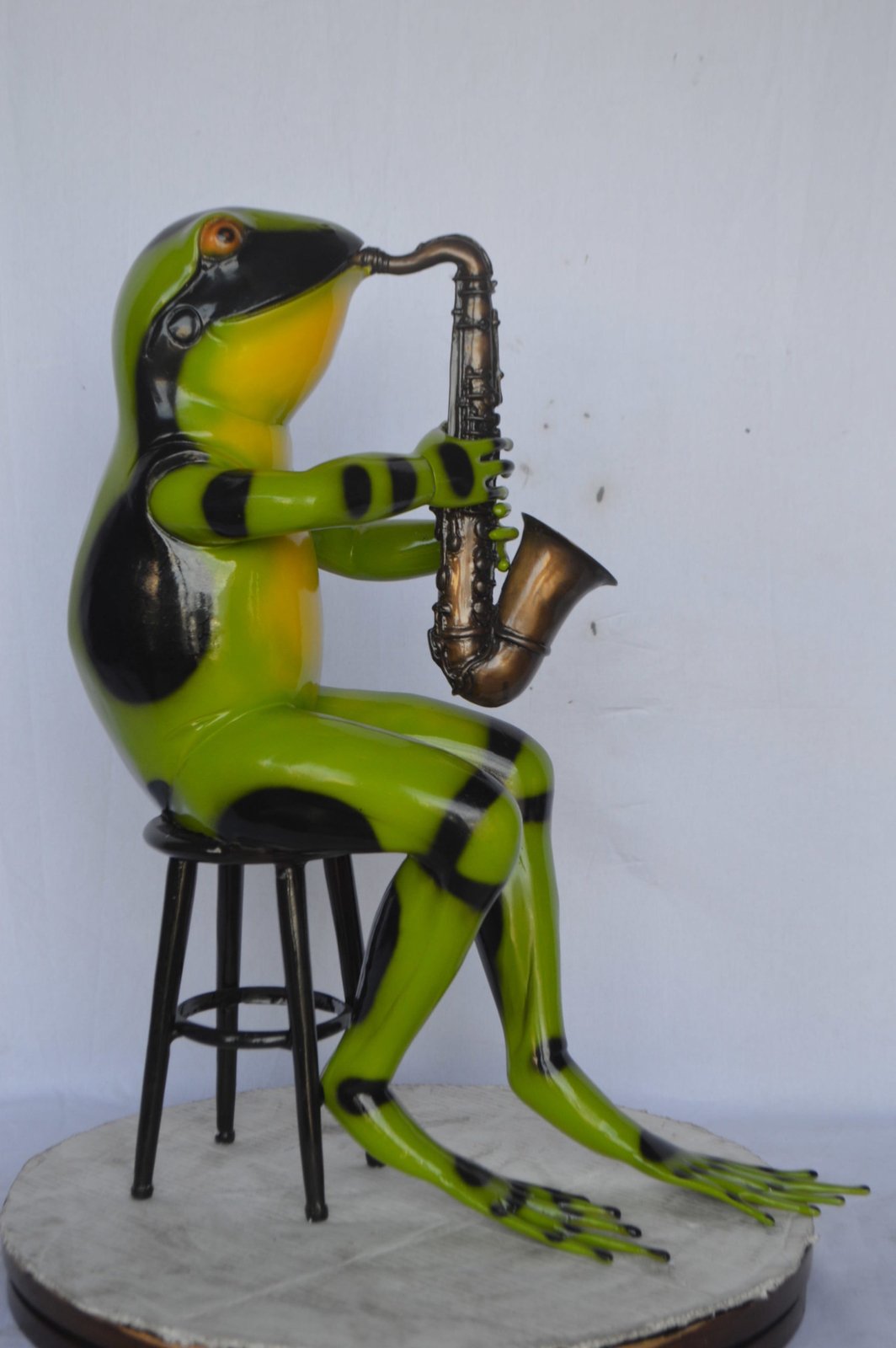 Green frog playing saxophone bronze statue - Size: 23"L x 15"W x 30"H.