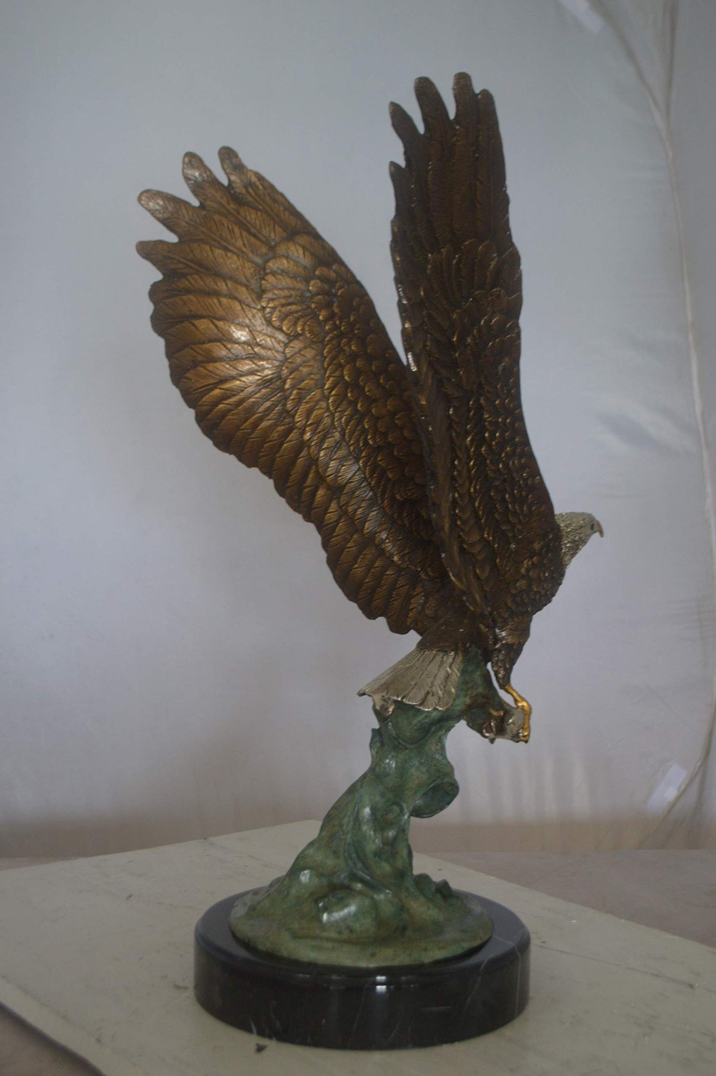 Eagle Catching His Prey from Water Bronze Statue -  Size: 14"L x 13"W x 26"H.