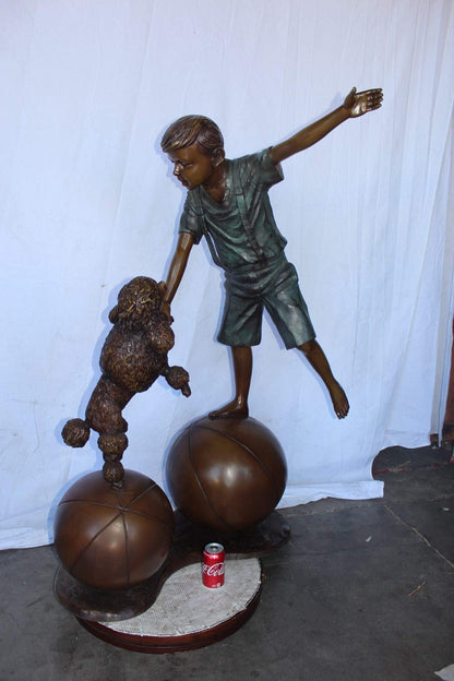 Boy and poodle balancing circus stars bronze statue -  Size: 38" x 27" x 55"H.