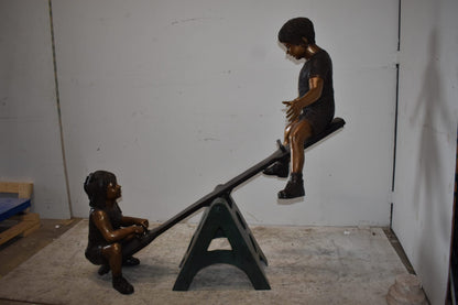 Playful Children on a See-Saw Bronze Statue Size: 76" x 27" x 59"H