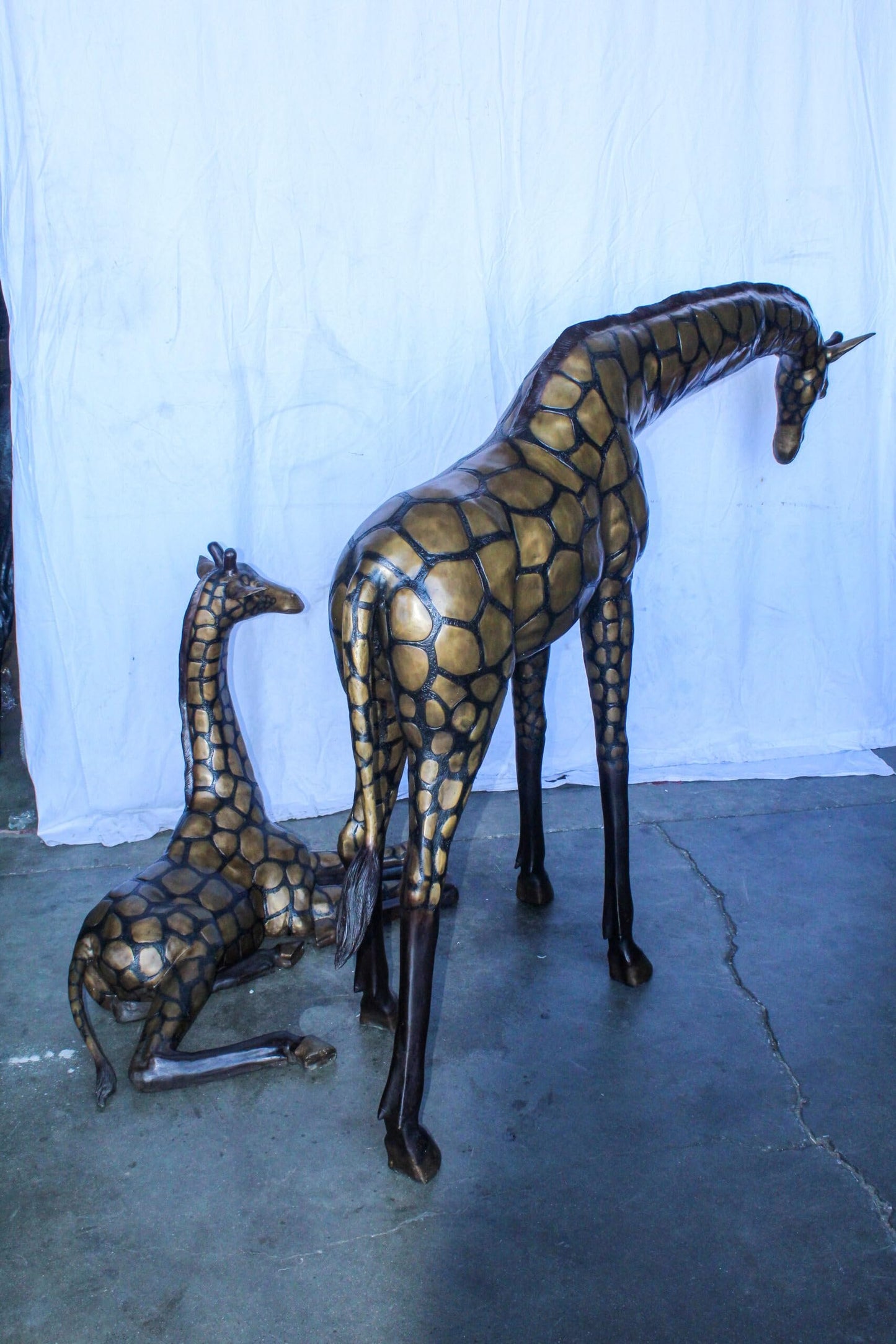 Life Size Bronze Giraffes Statues, One Laying, One Standing 77" x 21" x 58"H