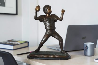 Young Quarterback bronze statue - Size: 14"L x 6"W x 20"H.