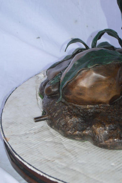 Crane standing on a stone bronze statue -  Size: 28"L x 32"W x 49"H.