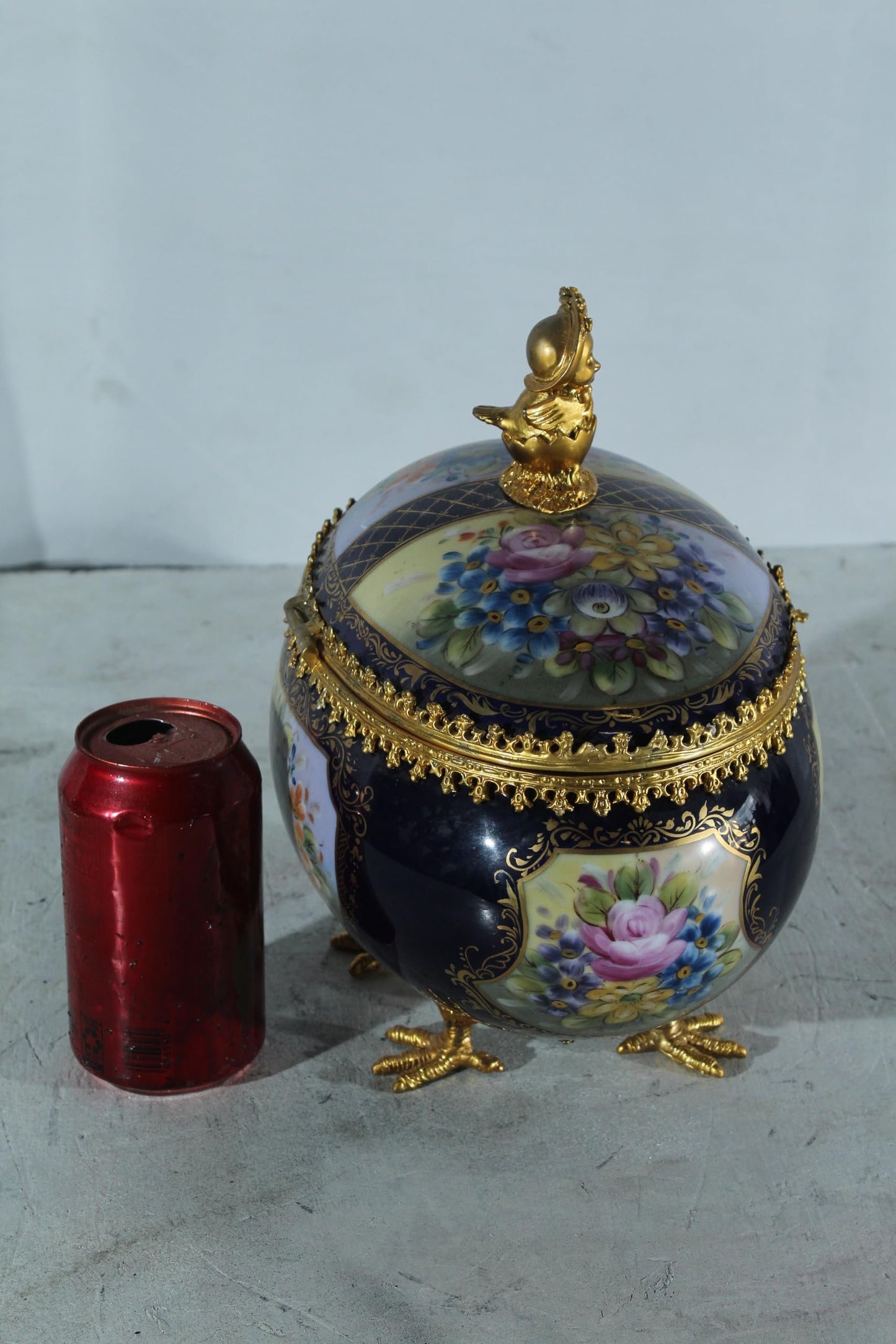 NIFAO Porcelain floral egg shaped lidded box with cherub and chicken feet 11"x8"x12"H