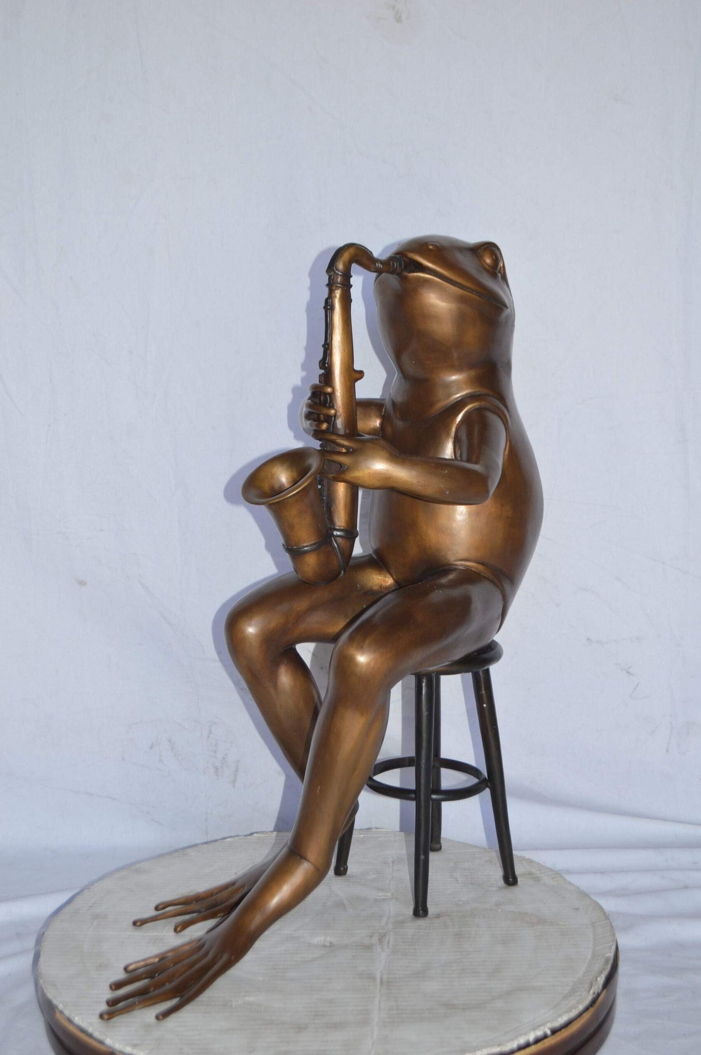 Frog playing saxophone bronze statue - Size: 23"L x 15"W x 30"H.