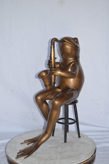 Frog playing saxophone bronze statue - Size: 23"L x 15"W x 30"H.