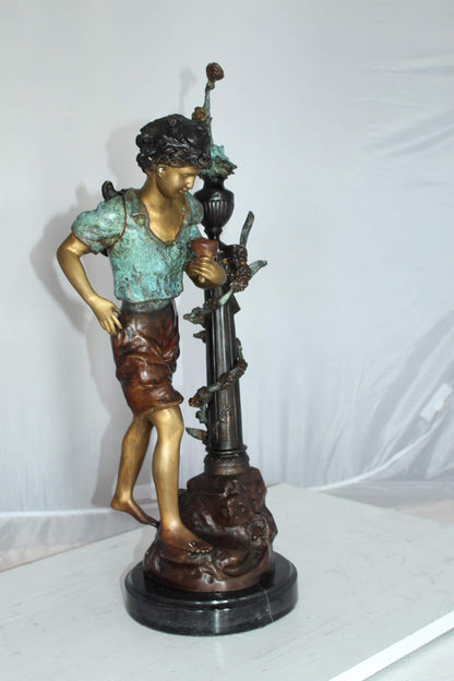 Les Amenes Boy Bronze Statue -  Size: 9"L x 8"W x 25"H.