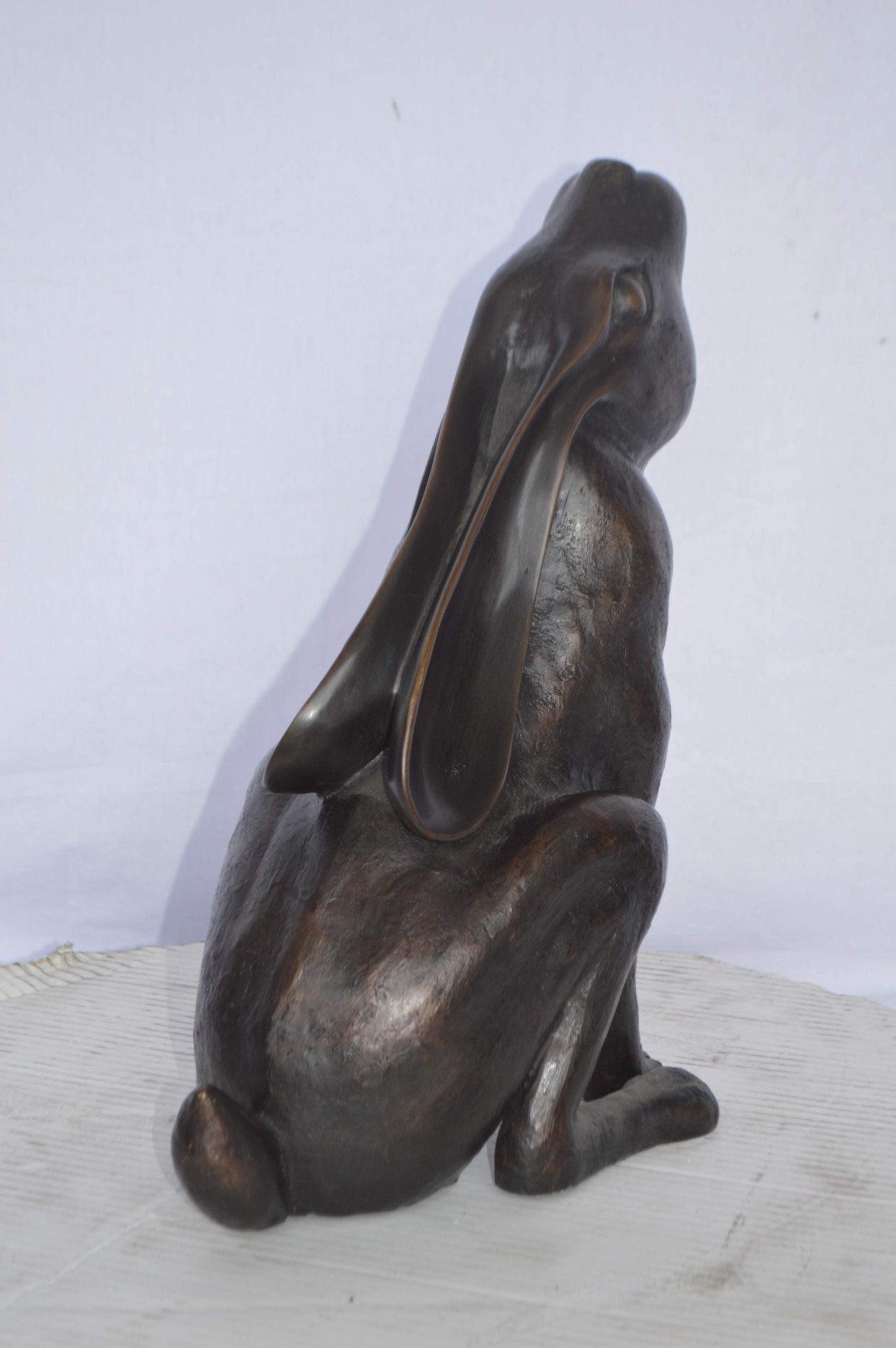 Rabbit Gazing Up Bronze Statue - Size: 8"L x 14"W x 16"H.