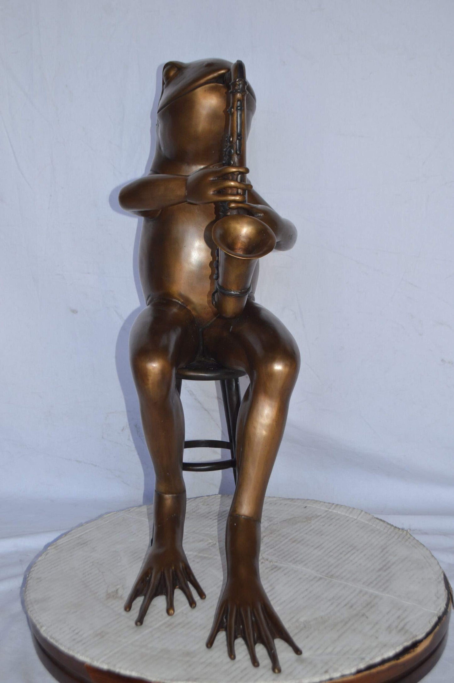 Frog playing saxophone bronze statue - Size: 23"L x 15"W x 30"H.