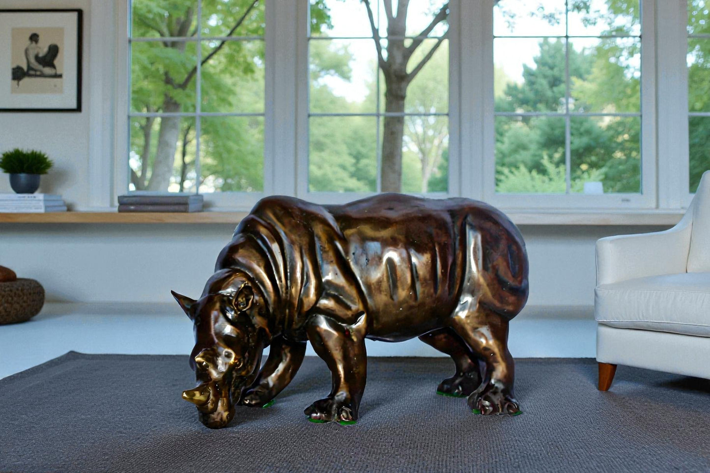 Relaxed Rhino bronze statue -  Size: 16"L x 9"W x 8"H.