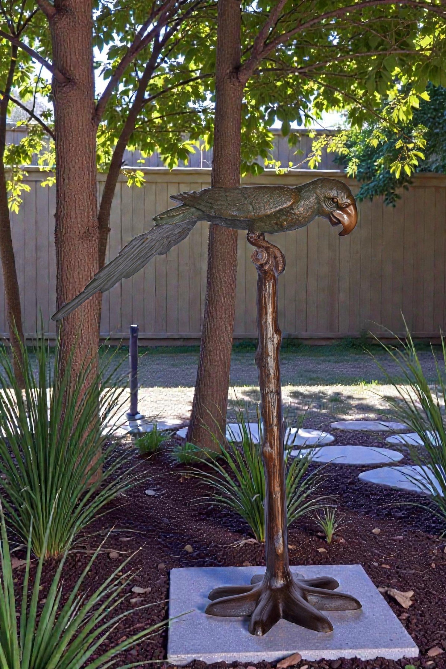 Parrot on a Tree Watching Forward Bronze Statue - Size: 36"L x 15"W x 41"H.