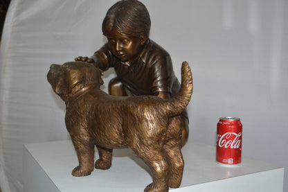 Boy and Dog Bronze Statue - Size: 30"L x 18"W x 18"H.