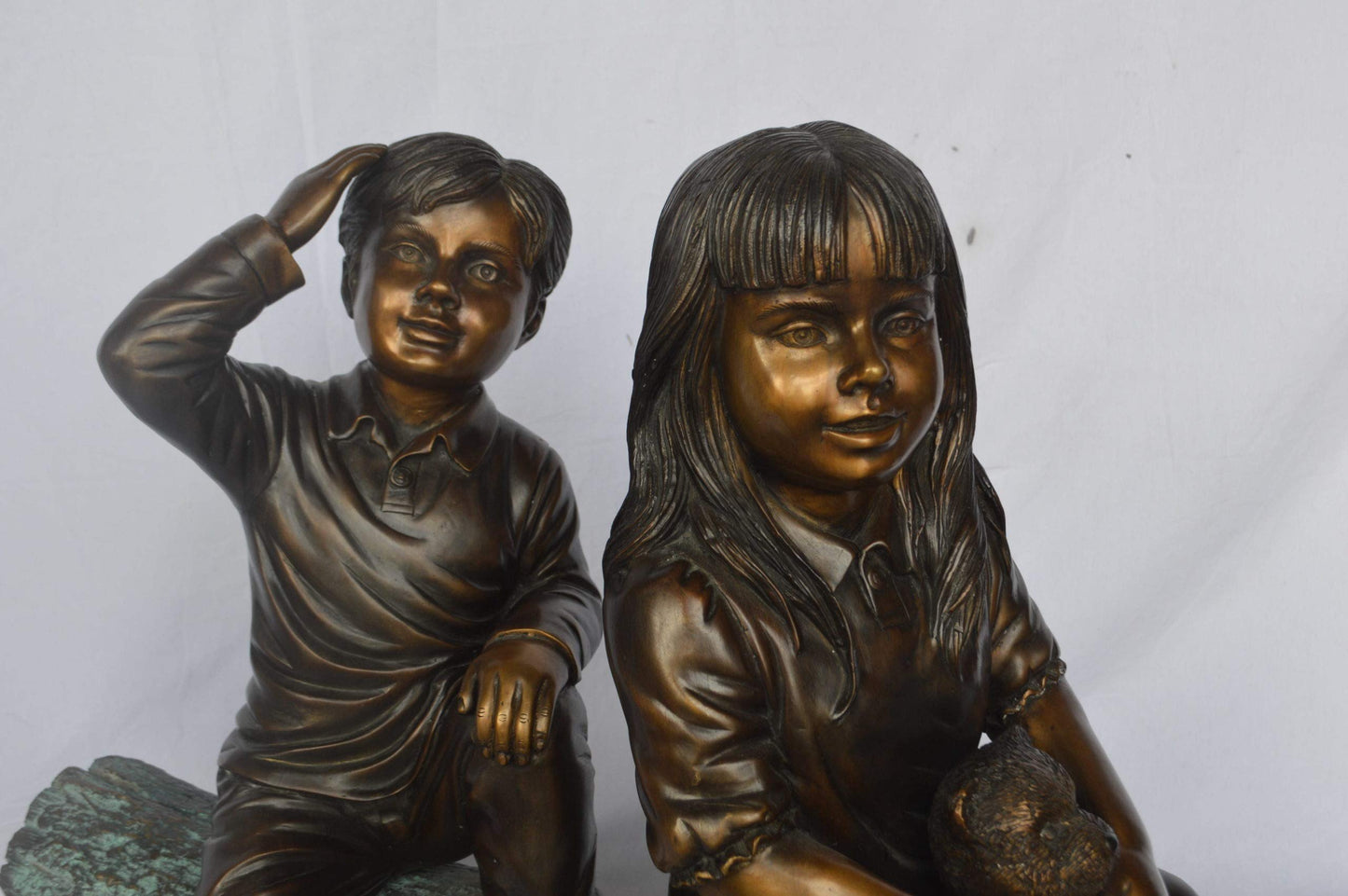 Young children and dog on a log bronze statue - Size: 40"L x 16"W x 24"H.