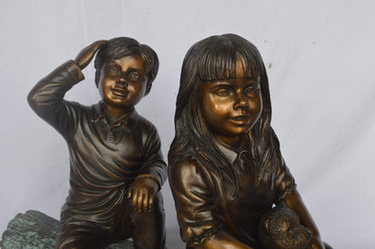 Young children and dog on a log bronze statue - Size: 40"L x 16"W x 24"H.