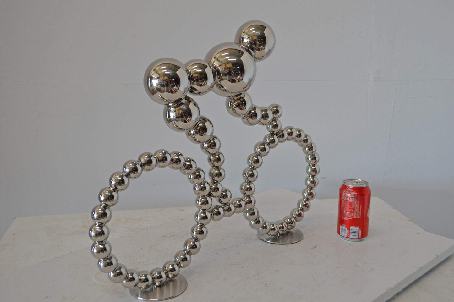 Modern Art Rider on His Bicycle Chrome Statue - Size: 22"L x 4"W x 17"H.