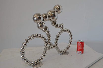 Modern Art Rider on His Bicycle Chrome Statue - Size: 22"L x 4"W x 17"H.