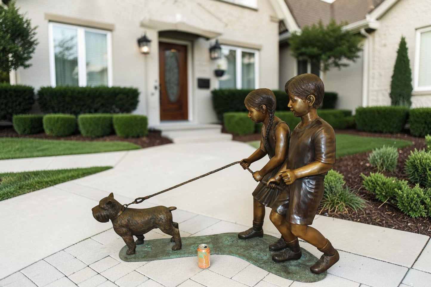 Two Kids Walking a dog Bronze Statue -  Size: 55"L x 28"W x 37"H.