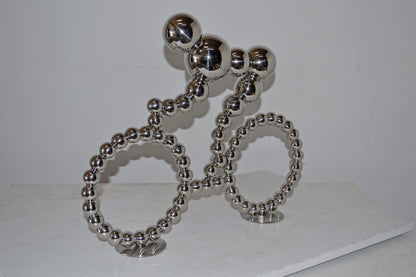 Modern Art Rider on His Bicycle Chrome Statue - Size: 22"L x 4"W x 17"H.