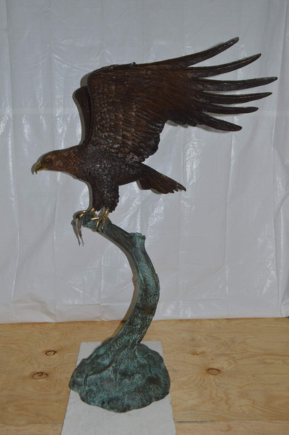 Eagle on a Tree Branch Bronze Statue -  Size: 44"L x 50"W x 65"H.