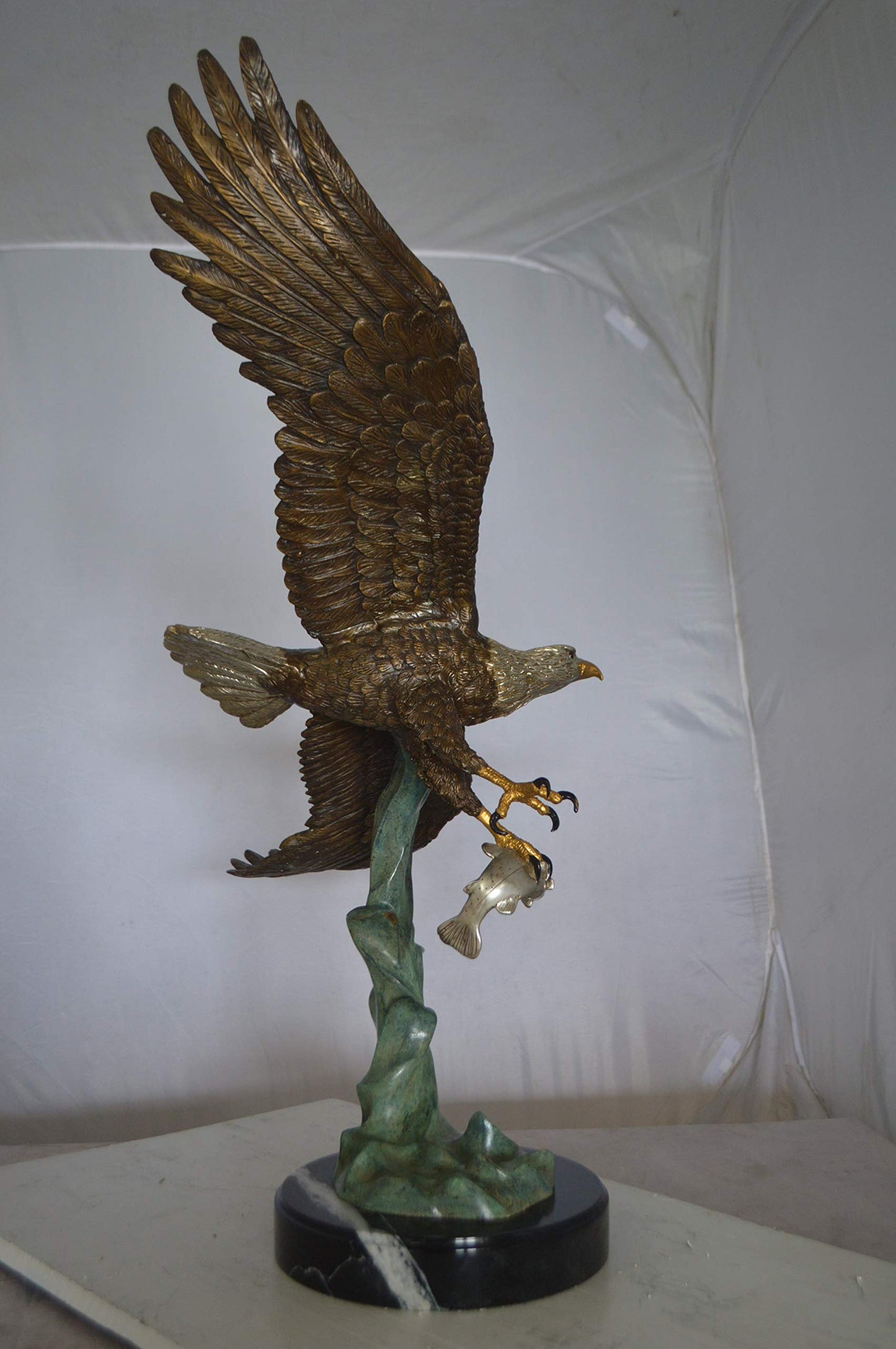 Eagle Flying With His Pray Bronze Statue -  Size: 32"L x 15"W x 33"H.