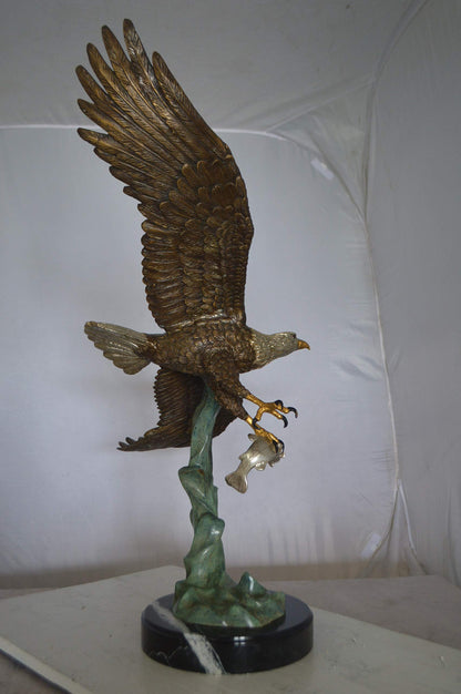 Eagle Flying With His Pray Bronze Statue -  Size: 32"L x 15"W x 33"H.