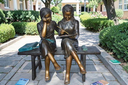 Two Schoolgirls Sitting On a Bench Bronze Statue -  Size: 45"L x 24"W x 41"H.