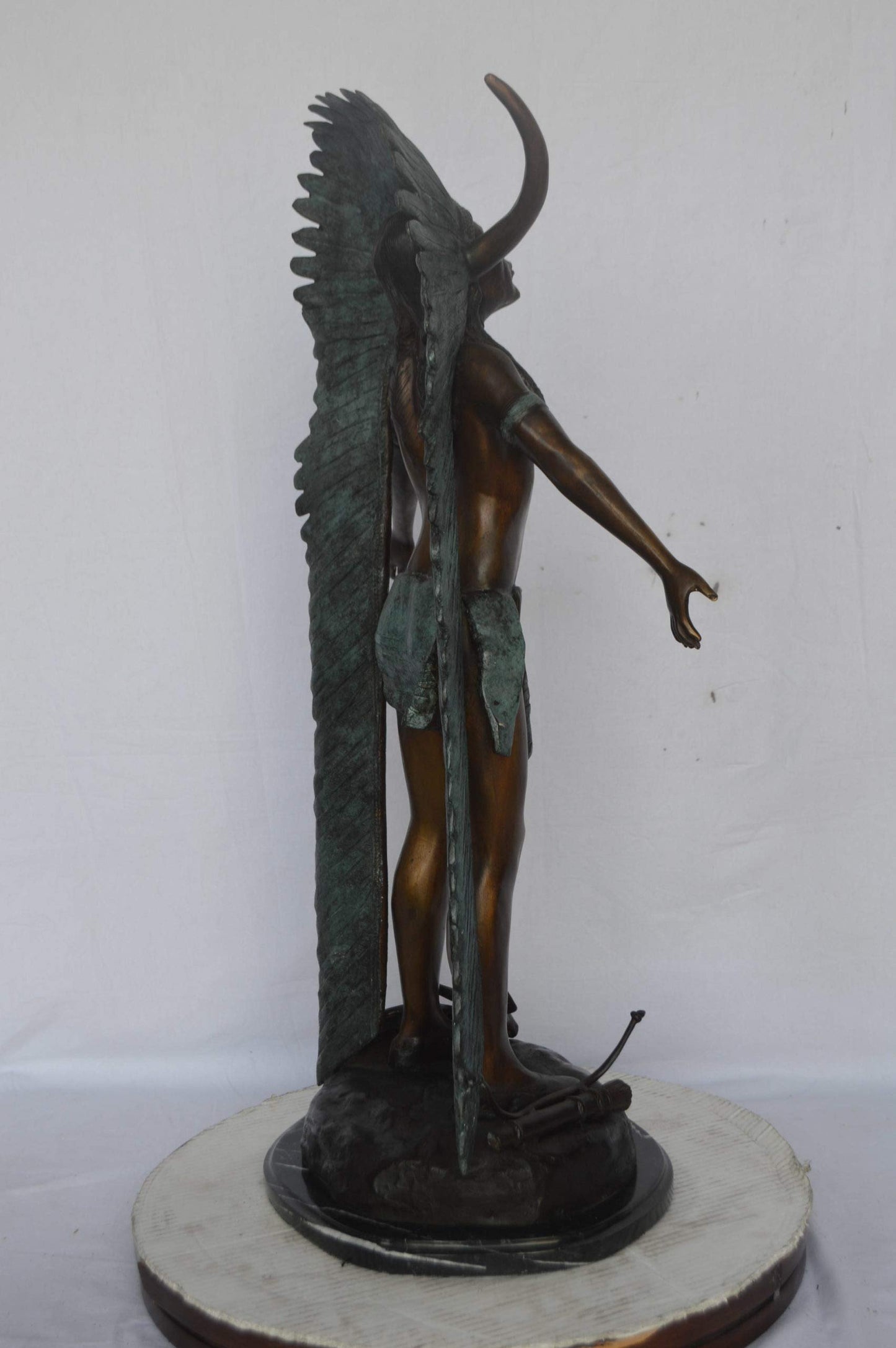 Indian with Plume bronze statue - Size: 22"L x 14"W x 38"H.