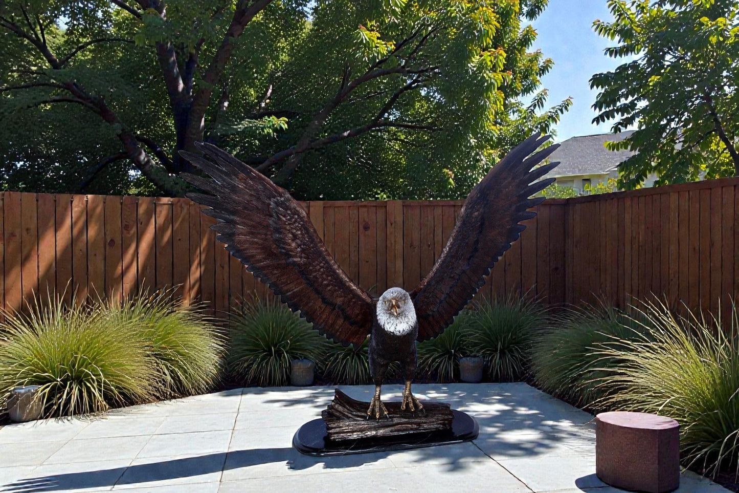 Perched eagle bronze statue -  Size: 35"L x 21"W x 29"H.