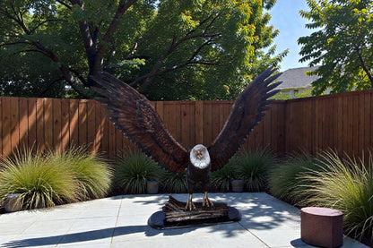 Perched eagle bronze statue -  Size: 35"L x 21"W x 29"H.