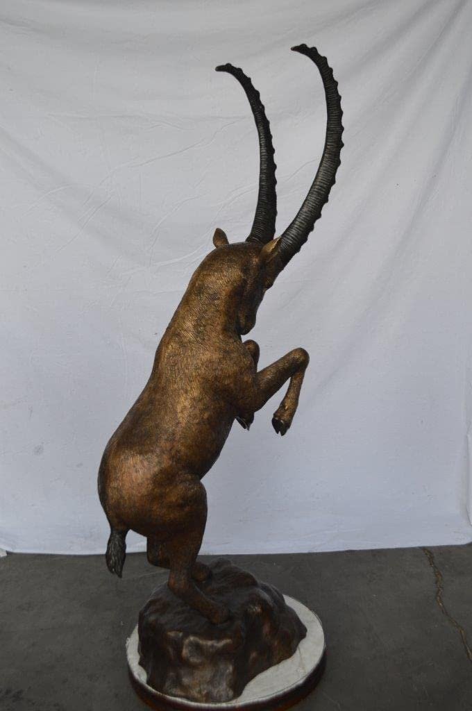 Mountain goat on hind legs bronze statue -  Size: 36"L x 16"W x 66"H.