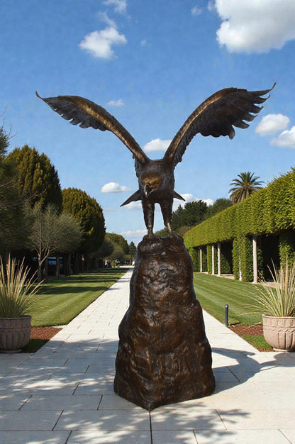 Eagle Landing on a Rock Bronze Statue - Size: 51"L x 36"W x 58"H.
