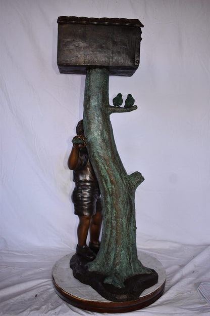 A Boy Standing by His Mailbox Looking at Birds Bronze Statue  25" x 22" x 51"H.