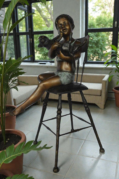 Girl with a cat on a high chair bronze statue -  Size: 16"L x 16"W x 38"H.
