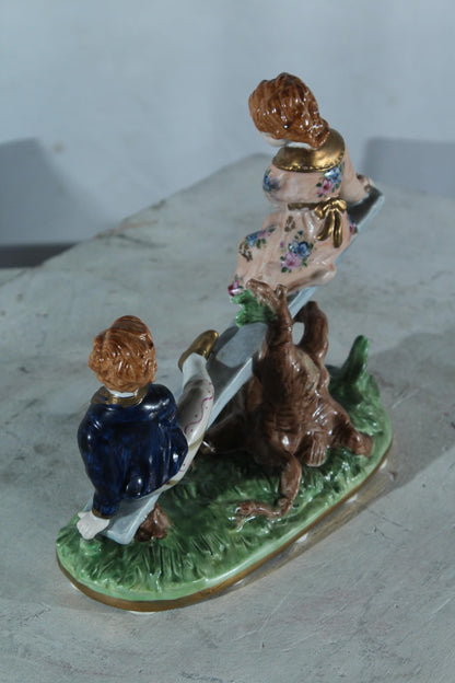 NIFAO Porcelain boy and Girl on Seesaw Figurine Vintage Style 10"x4"x9"H