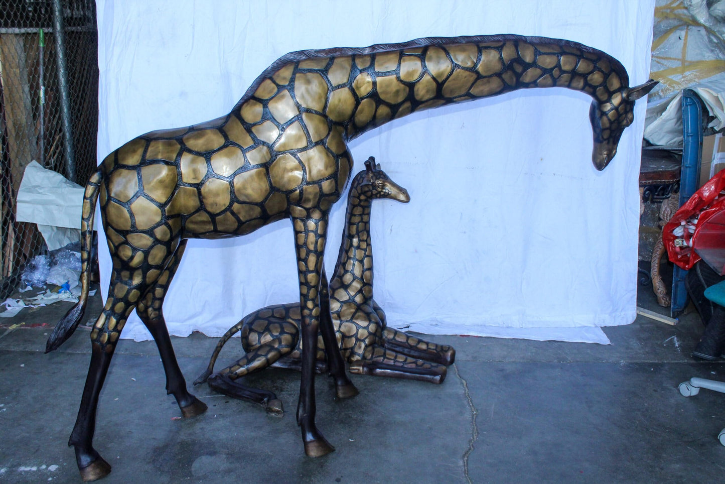 Life Size Bronze Giraffes Statues, One Laying, One Standing 77" x 21" x 58"H
