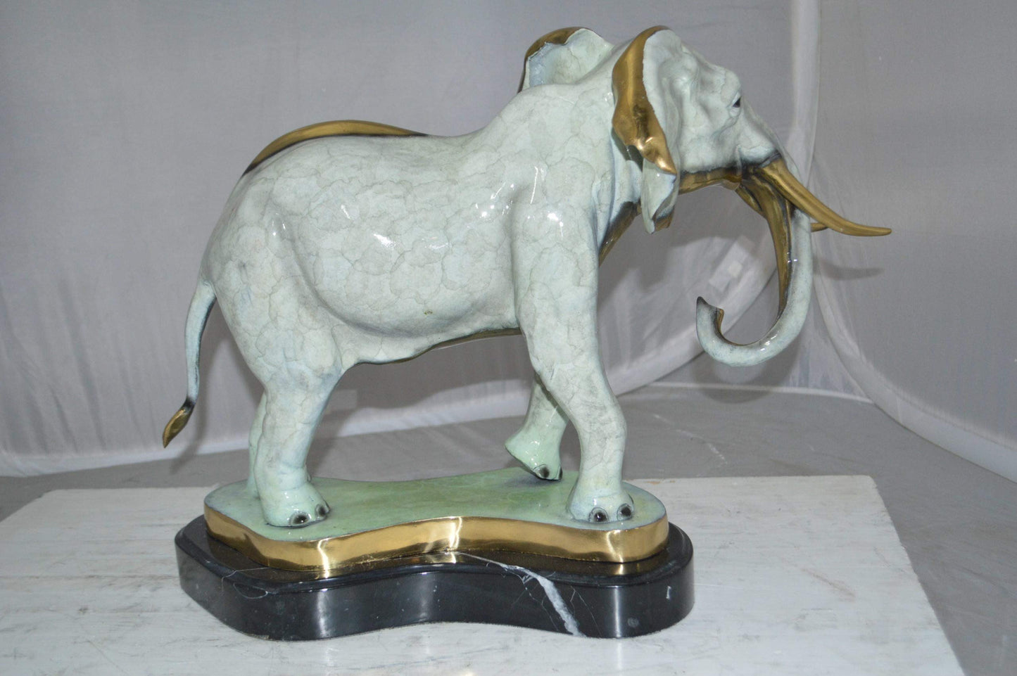 Elephant trunk Down Bronze Statue -  Size: 28"L x 12"W x 17"H.