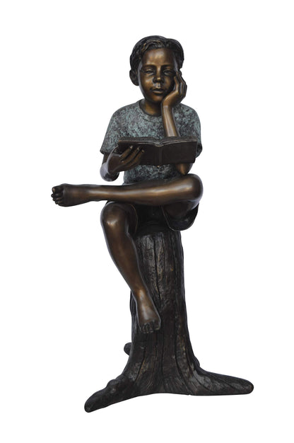 Boy Sitting on a Stump Reading a Book -  Size: 18"L x 20"W x 35"H.