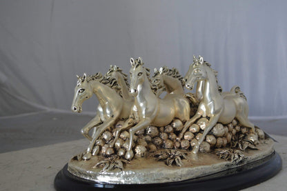Charging horses resin statue on wood base - Size: 17"L x 10"W x 5"H.
