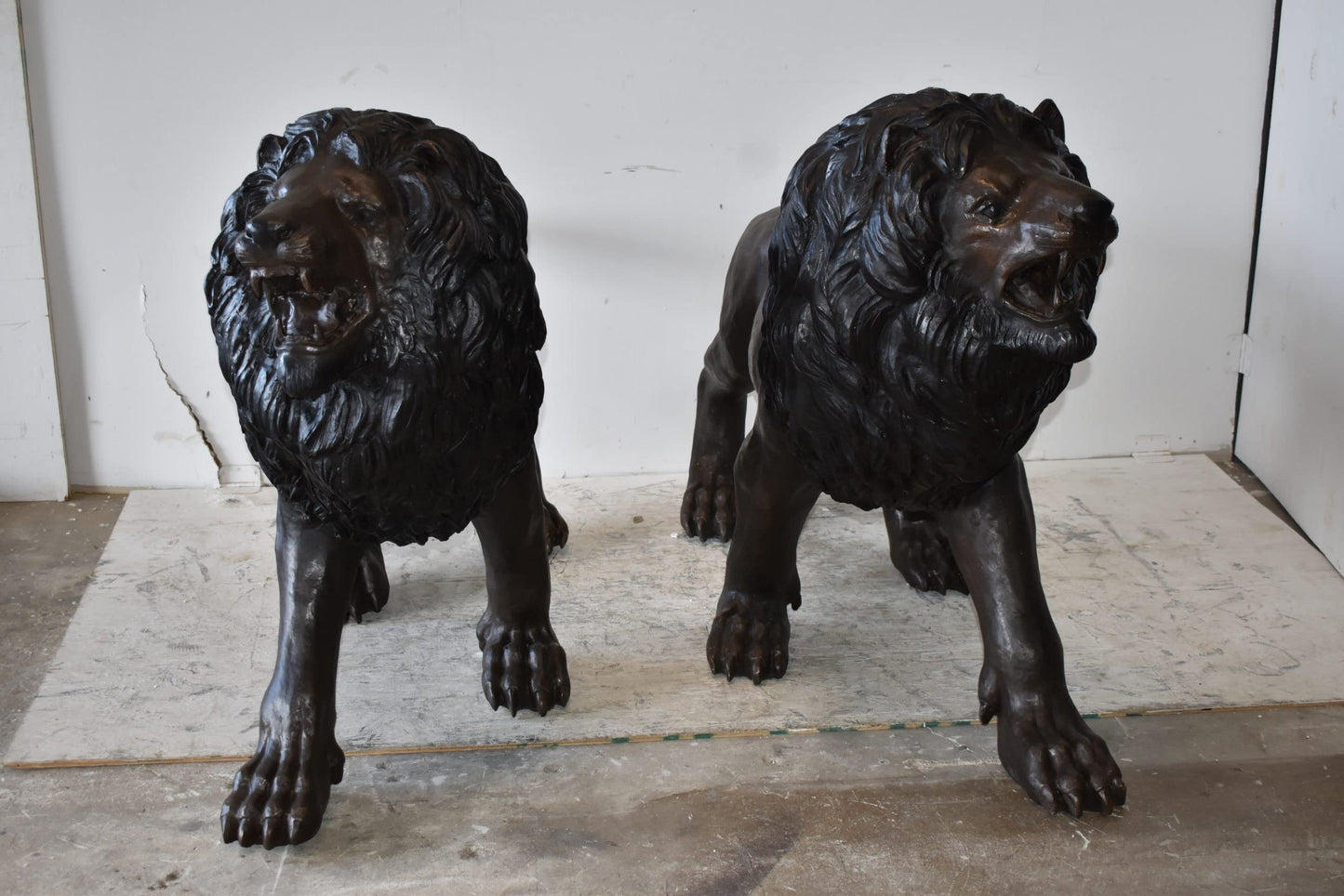 A Pair of Large Lions Walking Side by Side Bronze Statues Size: 24" x 60" x 41"H