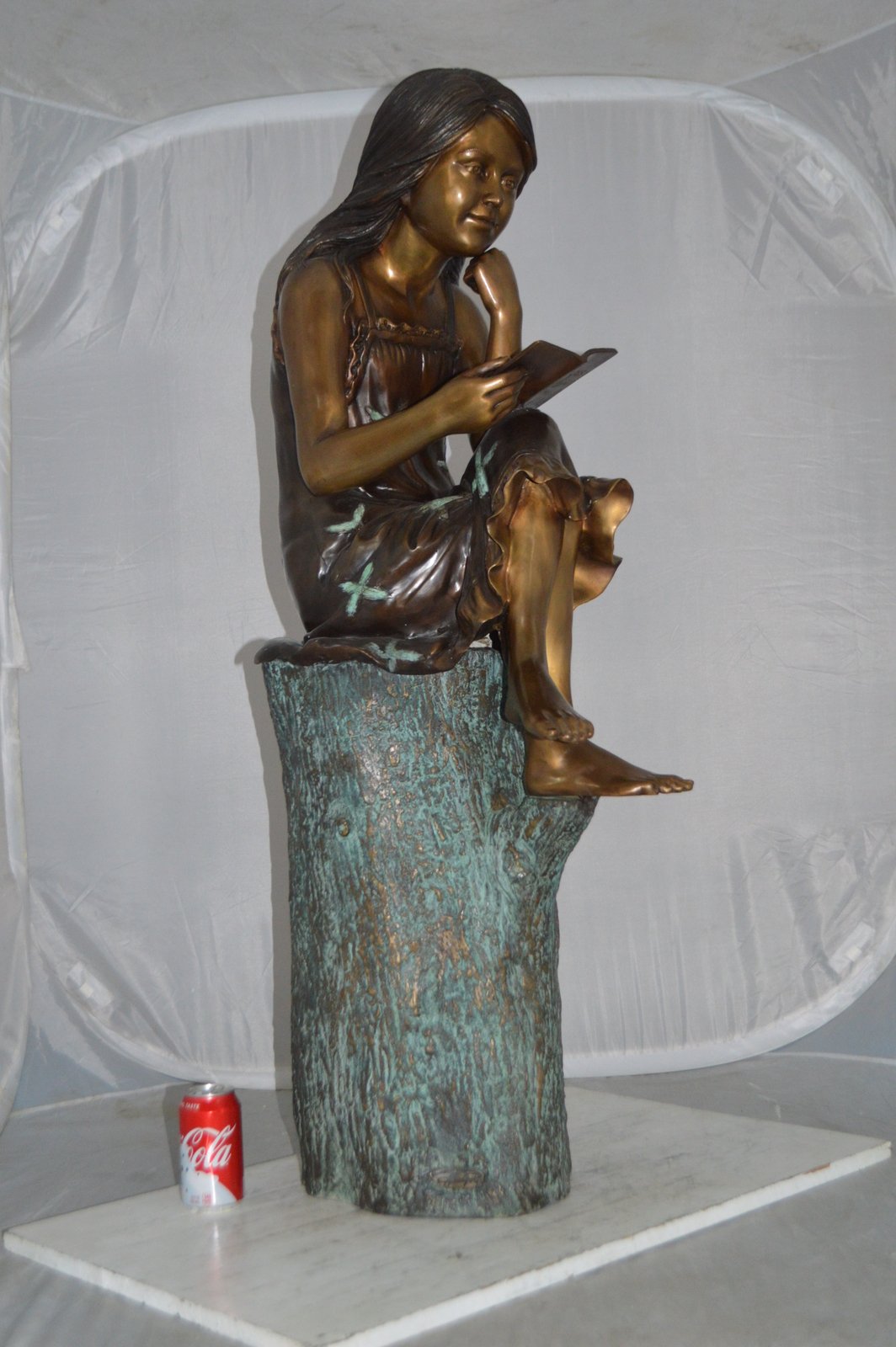 Sitting Girl on Log Reading a Book Bronze Statue -  Size: 19"L x 13"W x 48"H.
